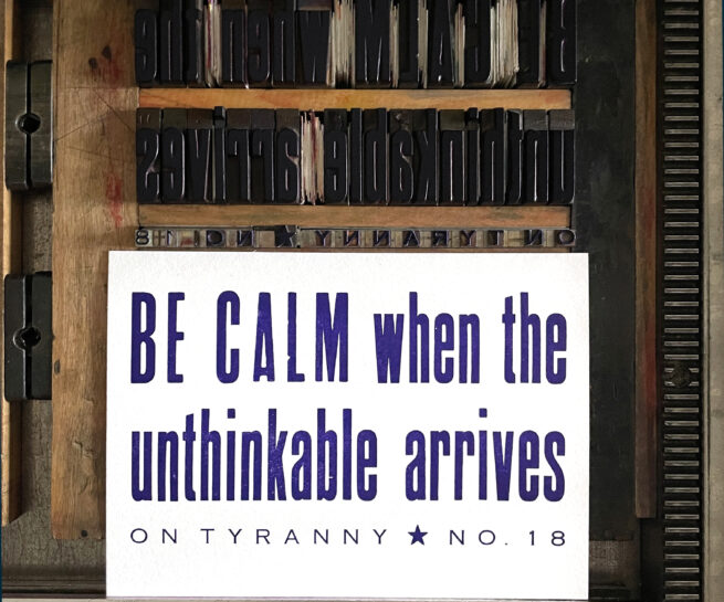 Letterpress print on Vandercook press bed. Printed in purple ink on white paper, the text reads "Be Calm When The Unthinkable Arrives On Tyranny No. 18."