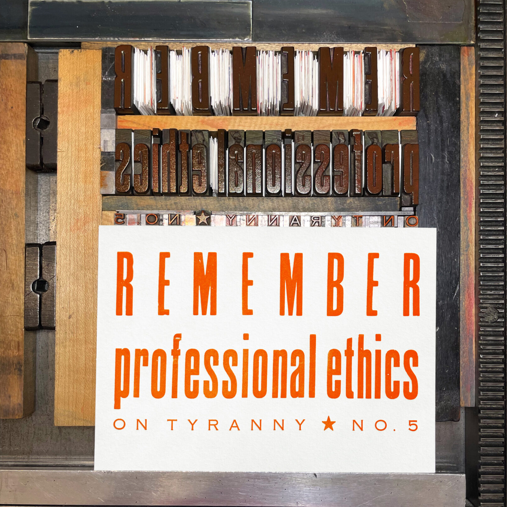 Letterpress print on Vandercook press bed. Printed in red ink on white paper, the text reads "Remember Professional Ethics On Tyranny No. 5."
